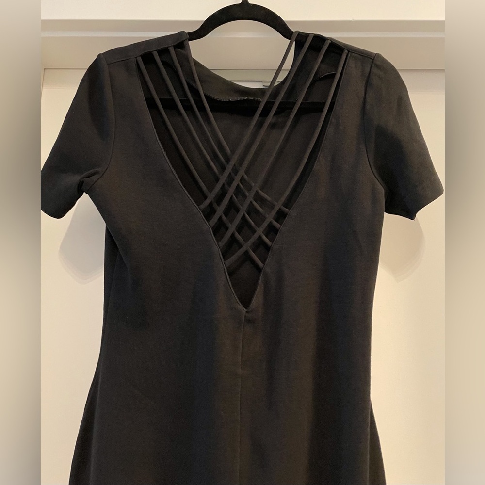 Outlander, form fitting, stretchy, criss cross back  black dress.